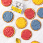 The India Tree Nature's Colors Decorating Set displayed beside cookies with vibrant natural frosting, showcasing the results of this natural food coloring.